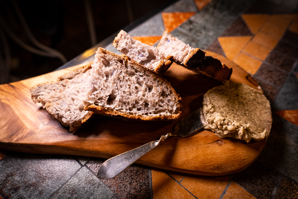 Sourdough with roasted kombu butter at Botanik, a seasonal, mostly plant-based sustainable restaurant in Shanghai. Photo by Rachel Gouk. 