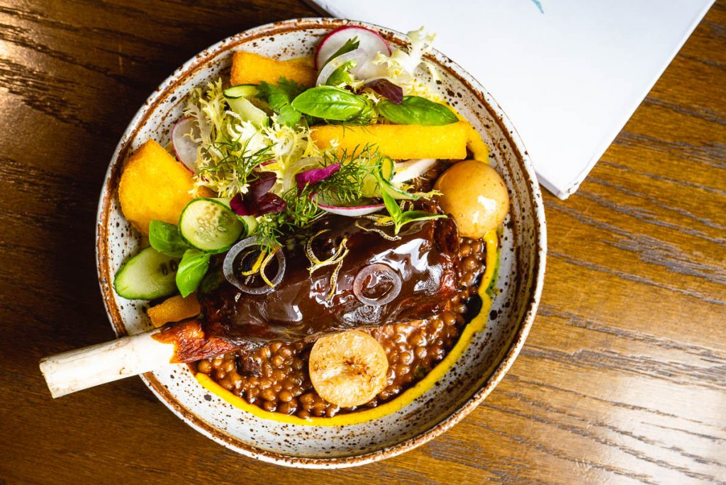 Braised lamb shank for Brunch at Atto Primo on the Bund, an Italian restaurant in Shanghai. Photo by Rachel Gouk. 