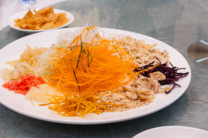 Yee Sang or Lou Hei or Yu Sheng is a popular festive dish in Malaysia and Singapore, eaten during Chinese New Year for prosperity and luck.