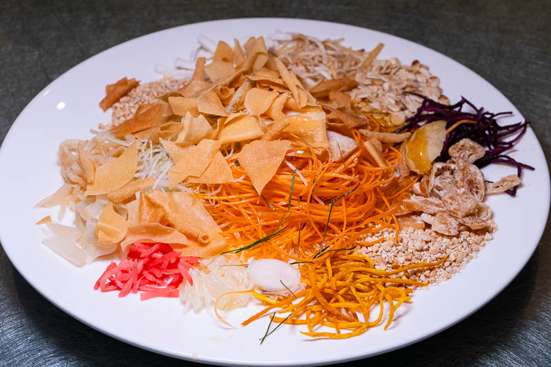Yee Sang or Lou Hei or Yu Sheng is a popular festive dish in Malaysia and Singapore, eaten during Chinese New Year for prosperity and luck.