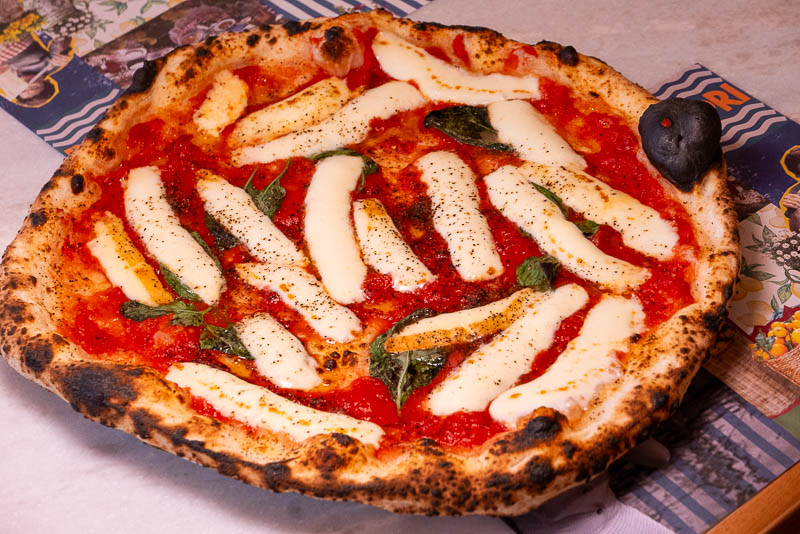 Capri by Bottega is an Italian restaurant and pizzeria specializing in cuisine from Naples like cartwheel pizza