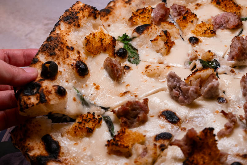 Capri by Bottega is an Italian restaurant and pizzeria specializing in cuisine from Naples like cartwheel pizza