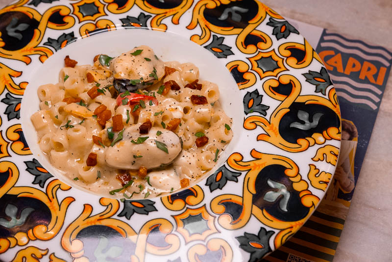 Capri by Bottega is an Italian restaurant and pizzeria specializing in cuisine from Naples like cartwheel pizza