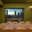 The dining room at Atelier Kau Lou in Shanghai faces a view of the city.
