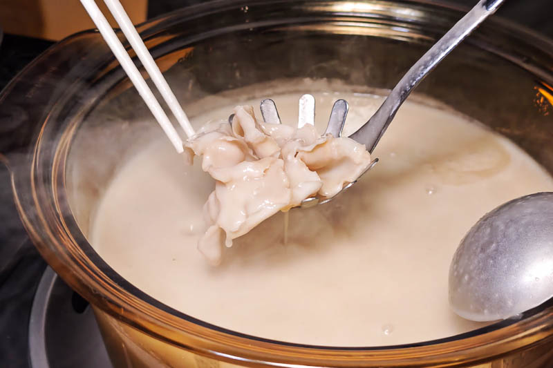 An off-menu dish of geoduck poached in seafood congee at Atelier Kaulou